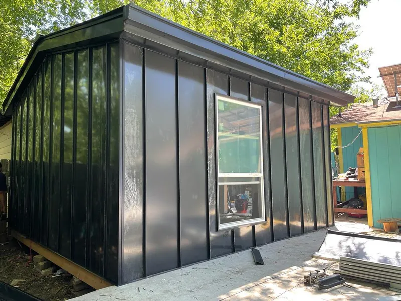 Black standing seam metal wall panels for Metal Roof Installation in Middlebury