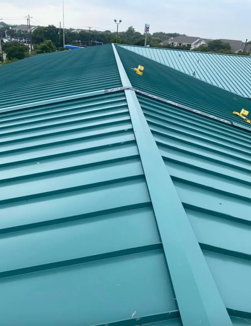 Green commercial metal roof ridge and valley for Metal Roof Repair in Middlebury